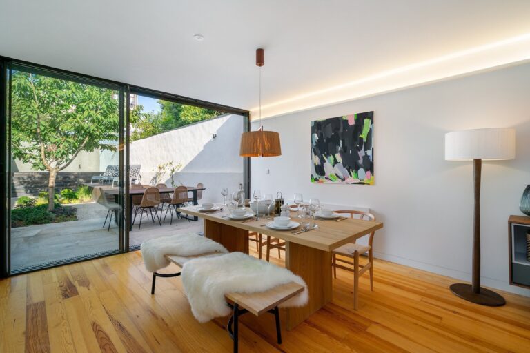 The dining table and glass doors onto the patio at Villa Almada