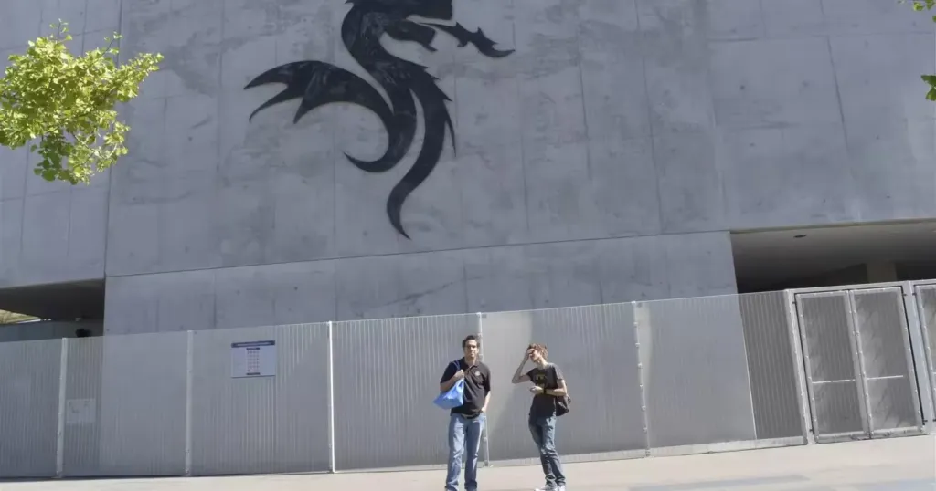 The FC Porto dragon emblem on the concrete facade of Estadio do Dragao