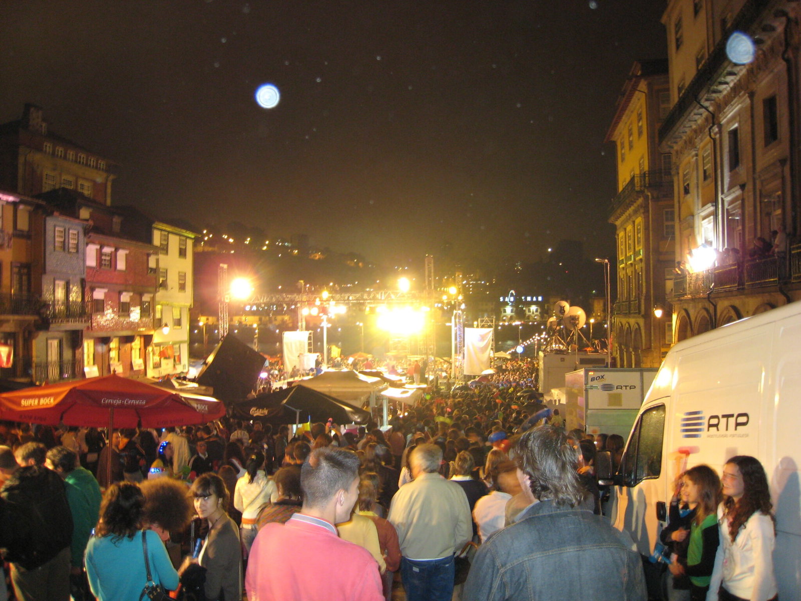 Crowds filling the streets of Porto at night during the Sao Joao festival in June