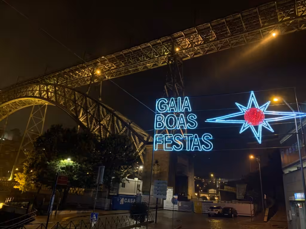 Boas Festas Christmas lights under the Dom Luis I bridge in Vila Nova de Gaia in December