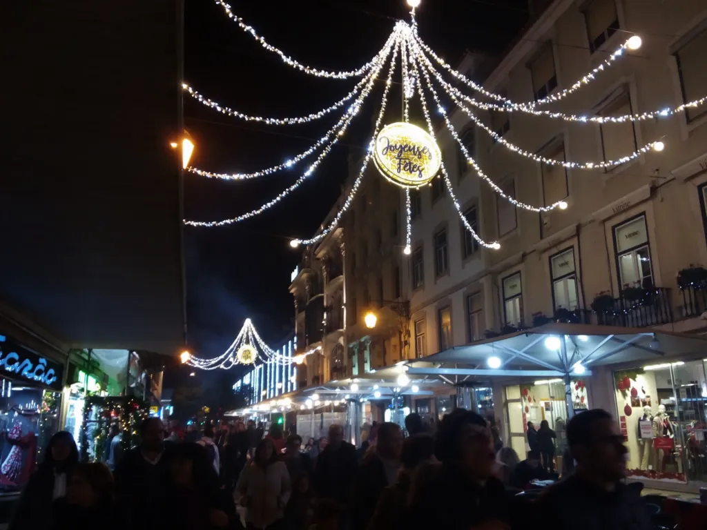 Christmas lights strung above Rua Augusta in Lisbon in December